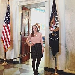 Anna Pope in front of a congressional office