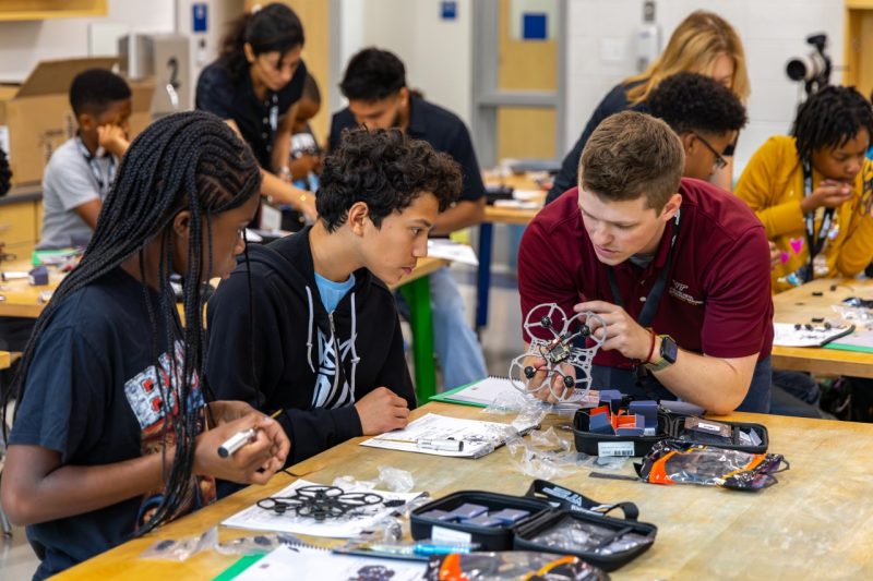 students clear catapults in summer camp